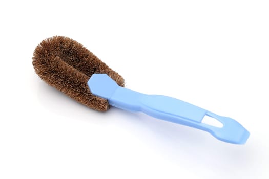 Coconut coir fiber scrubbing brush with handle on white background