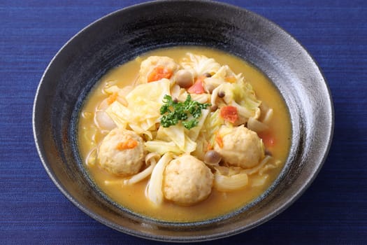 meat ball with vegetable soup in a dish on table