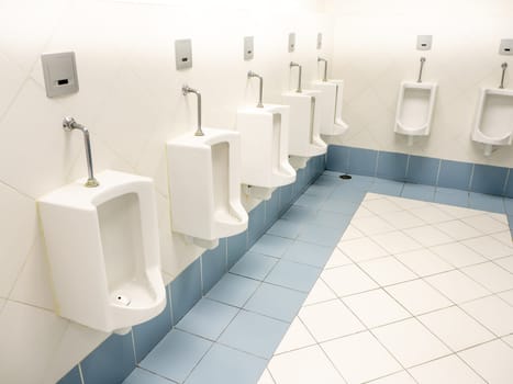 a clean new public modern toilet room empty