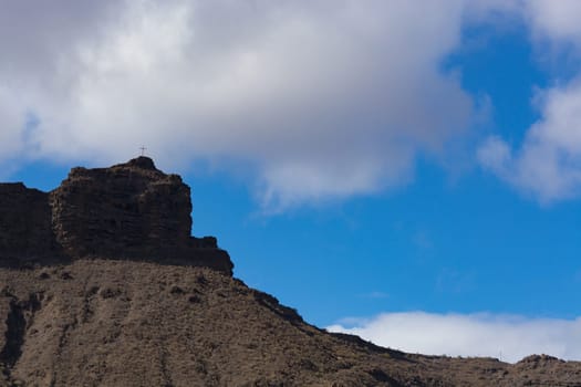 Mountains on the coast between Puerto de Mogan and Puerto Rico. Layers of volcanic rock.