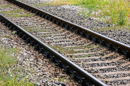 Close up shot of diagonal rail tracks.