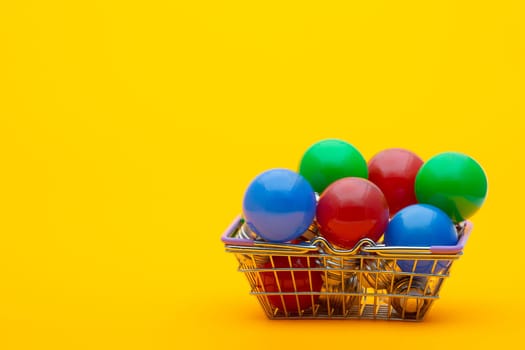 red, blue and green light bulbs in the consumer basket