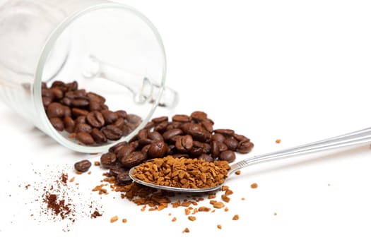 Macro shot of instant granules and beans coffee on a white background.