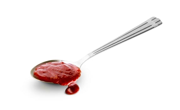 Red barbecue sauce in spoon isolated on white background with clipping path
