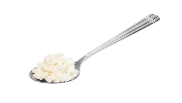 Cottage cheese in spoon isolated on white background with clipping path