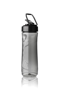 Sports bottle is covered with droplets. Isolated on white background. With clipping path