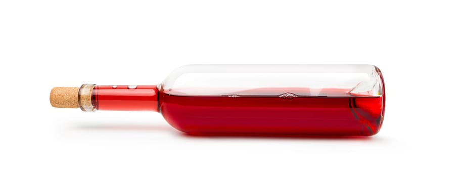 Closeup of a red wine bottle on a white background. With clipping path