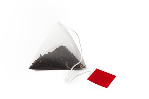 Pyramid shape teabag close up isolated on the white background