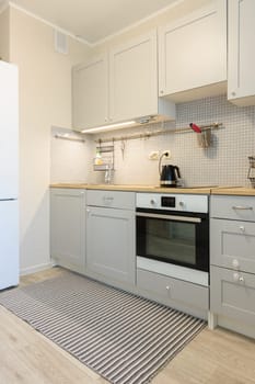 Interior of a modern kitchen with built-in appliances