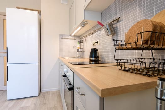 View along the countertop on a fragment of the interior of a modern kitchen