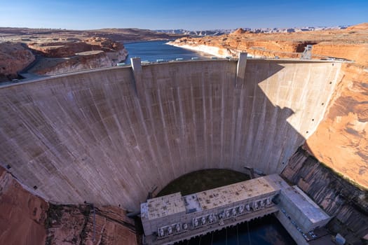 Glen Canyon Dam with Lake Powell in the Desert rural area of Page city Arizona, United States. USA Landmark environmental water resources reservoir and electricity concept.