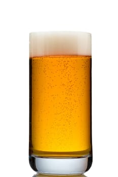 Golden beer with foam in a translucent glass close-up