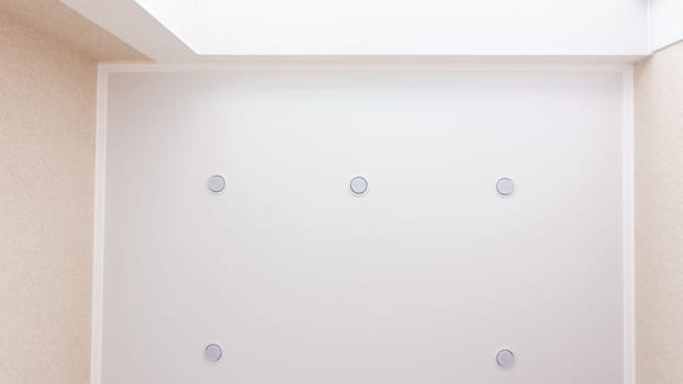 Room lighting by the window, five bulbs around the perimeter of the stretch ceiling