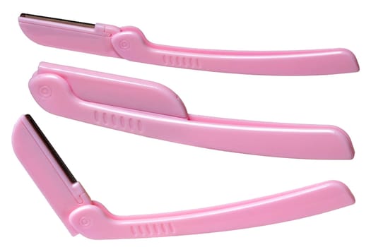 Cosmetic tools. Close-up of a pink eyebrow razor isolated on a white background. Beauty concept. Macro in three different views.