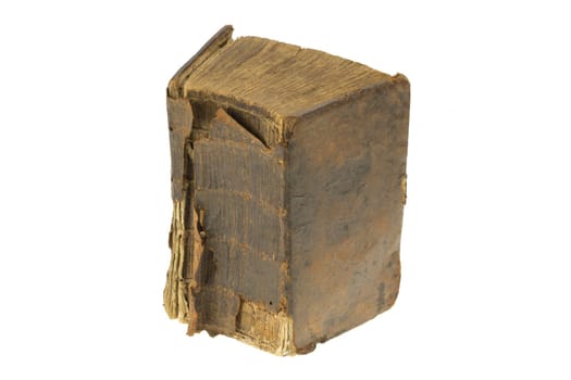 Books backgrounds. Close-up of a over 100 year old thick antique bible with tattered and torned cover isolated on a white background. Macro of ancient book.
