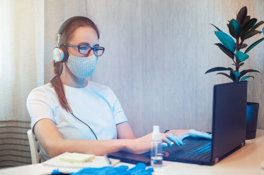 Coronavirus protective concept. Woman in office working with laptop