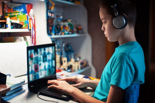 Distance learning or online education conference concept. Schoolboy studies at home and does school homework by laptop