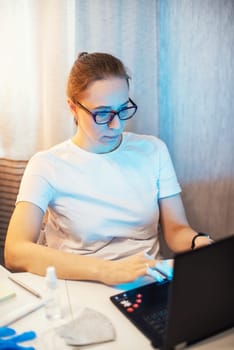 Coronavirus protective concept. Woman in office working with laptop