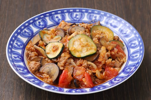 stir fry of vegetable with minced meat in a dish on table