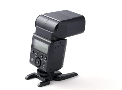 Photo camera flash on stand, isolated on white background
