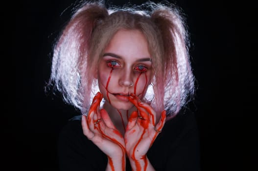 young blond woman with blue eyes and horror sfx makeup