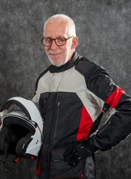 a portrait of senior biker with helmet