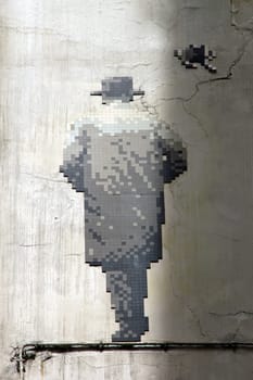Street art. Back man in mosaic. The walking man. Paris 6th district France