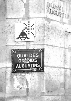 Street art. Mosaic. Invader. Paris Quai des Grands Augustins. France.
