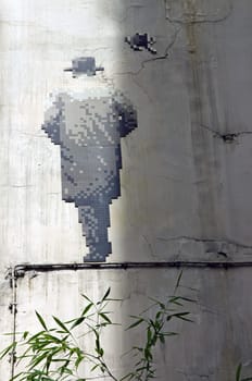 Street art. Back man in mosaic. The walking man. Paris 6th district France
