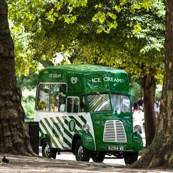 LONDON UK – AUGUST 18, 2014: London's Hyde Park showing an Old Morris Ice Cream Van