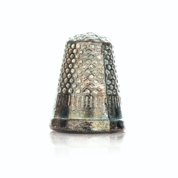 SWINDON, UK - DECEMBER 18, 2014: English Edition of Monopoly showing The Thimble Marker,  The classic trading game from Parker Brothers was first introduced to America in 1935.