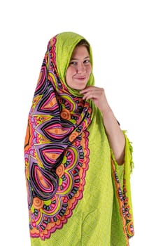 Smiling young girl with a green headscarf looks into the camera isolated on white