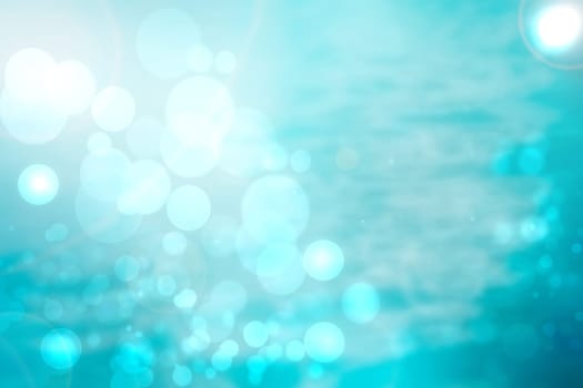 Abstract underwater illustration. Beautiful abstract gradient turquoise blue white lightening bokeh circles background texture from unterwater bubbles. Beautiful blue pastel backdrop.