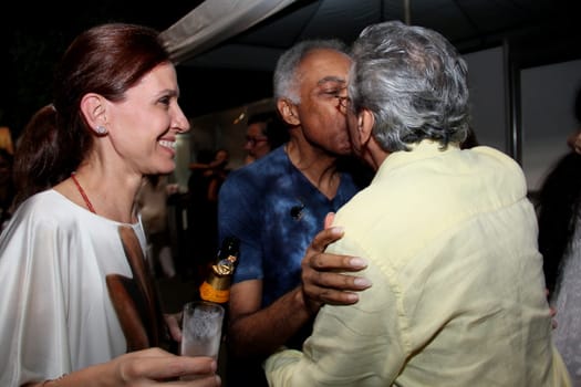 salvador, bahia / brazil - december 31, 2013: Singers Caetano Veloso and Gilberto Gil kiss each other during New Year's Eve festivities in Salvador.