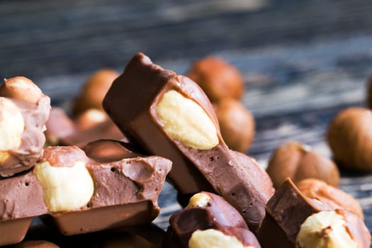 real quality milk chocolate with roasted hazelnut kernel, close-up of cocoa sweets
