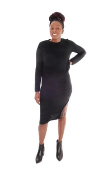 A young African American female standing in a tight gray dress .from the front, isolated for white background.