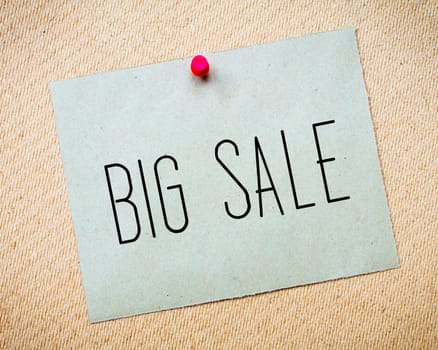 Recycled paper note pinned on cork board.Big Sale Message. Concept Image
