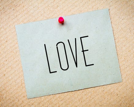 Recycled paper note pinned on cork board.Love Message. Concept Image