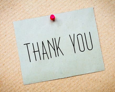 Recycled paper note pinned on cork board.Thank you Message. Concept Image