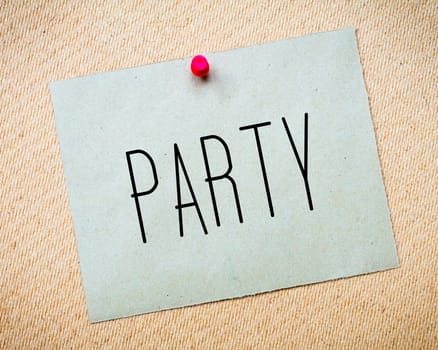 Recycled paper note pinned on cork board.Party Message.Fun Concept Image