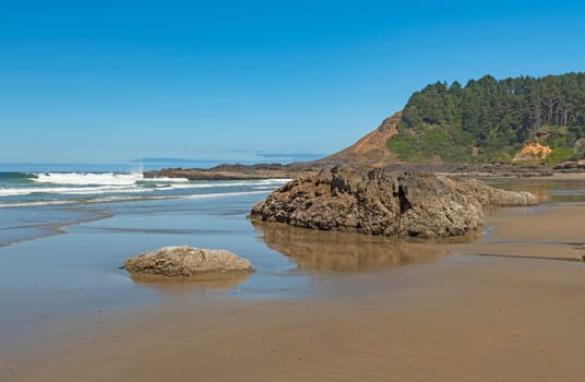 Tidal Reflections on the Coastal Headlands at the Strawberry Hill Beach on the Oregon Coast