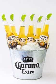 Calgary, Alberta, Canada. June 07, 2020. A bucket of Corona beer bottles with ice and limes