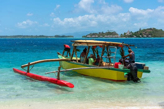 Shuttle outrigger boat overlooking Sofitel Bora Bora Private Island,Matira,Bora Bora,French Polynesia,Oceania