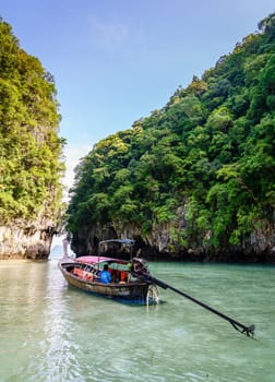 Krabi, Thailand, November 7, 2017: Traditional Thai motor boat by the entrance to a lagoon on Ko Hong island