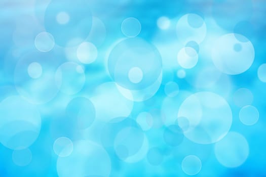 Abstract blurred fresh vivid spring summer light delicate pastel blue white bokeh background texture with bright circular soft color lights. Card concept. Beautiful backdrop illustration.