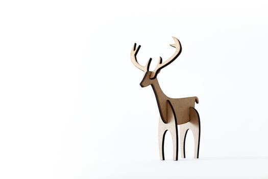 Single reindeer cardboard toy isolated on a white background. Christmas icon with Text space