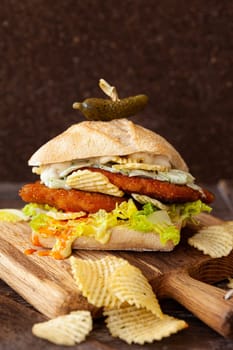 Over stuffed chicken sandwich and sour cream chips