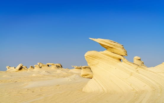 Sandstone formations in Abu Dhabi desert in United Arab Emirates