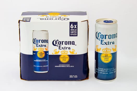 Calgary, Alberta, Canada. June 08, 2020. An isolated Corona Extra Six Pack Box and a Beer Can on a white background.