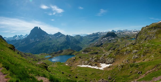 view of Pic du Midi Ossau and Ayous lake in the french Pyrenees mountains